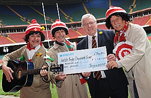 Handing the collection to WRU President, Dennis Gethin.